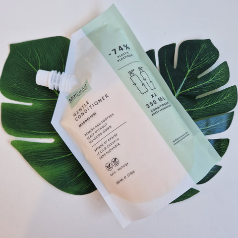 Mageau naturel magnesium Skincare product packaging on green leaves with visible brand name.