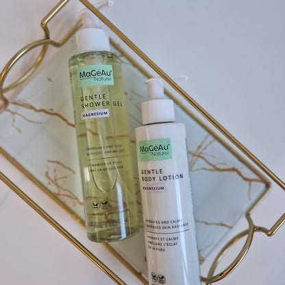 Three bottles of Mageau naturel magnesium skincare products on a decorative tray with a marble background.