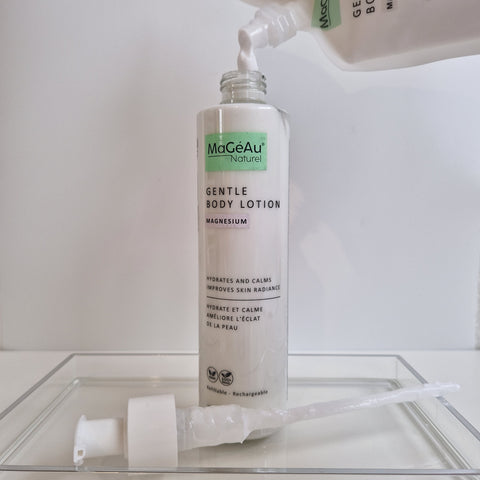 MaGéAu Naturel Gentle Body Lotion being applied with a pump on a white background