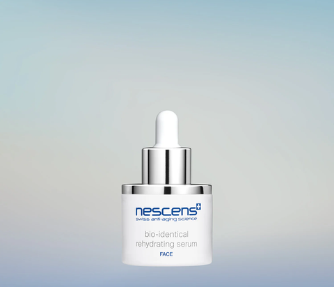 Nescens Bio-Identical Rehydrating Serum dropper releasing clear serum