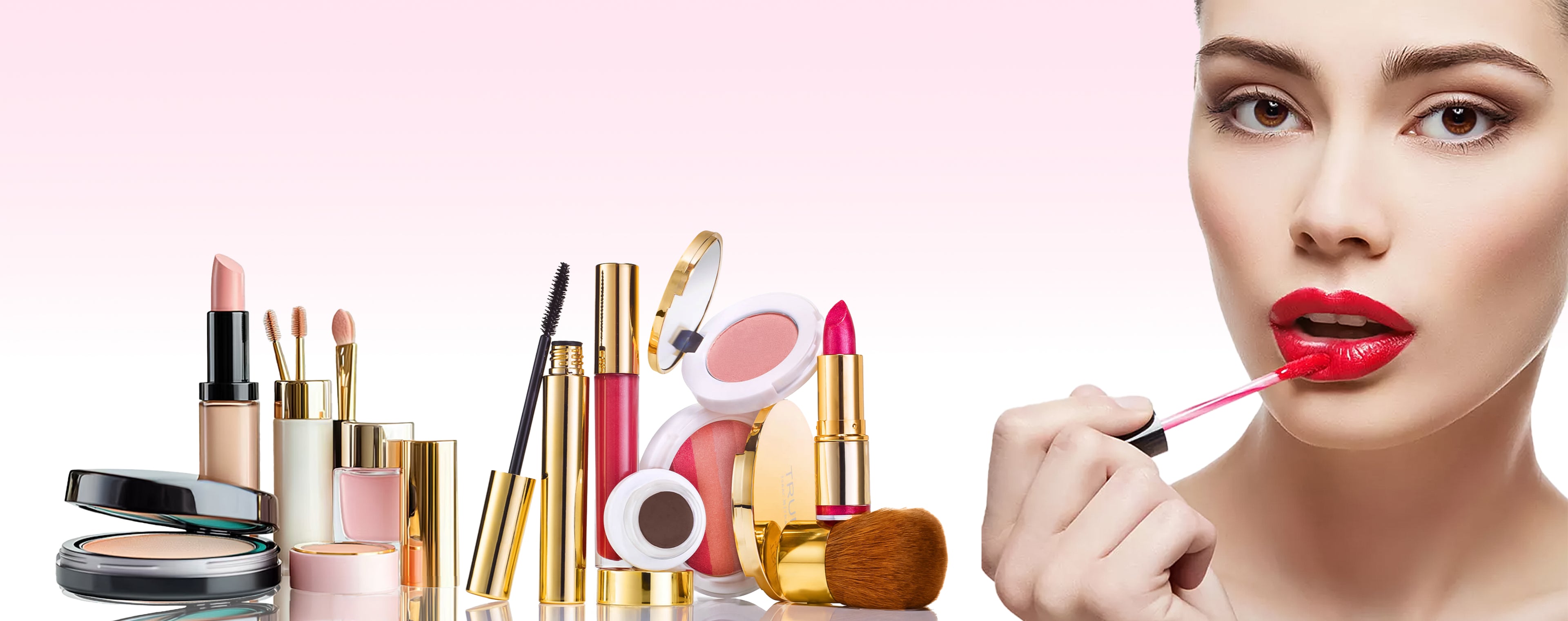Makeup products including lipsticks, brushes, and a woman applying lipstick on a pink background